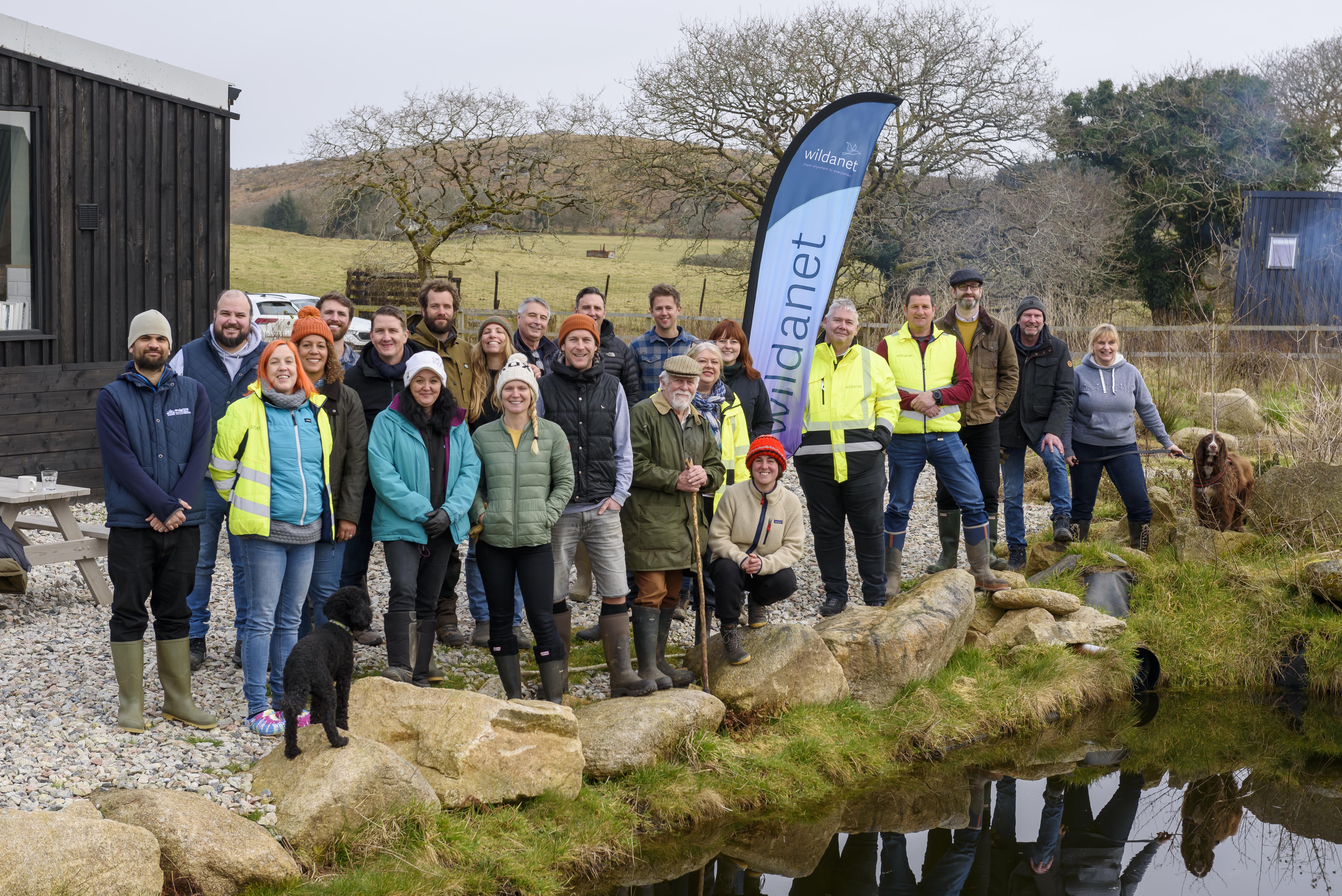 wildanet team standing for a photo next to a pond