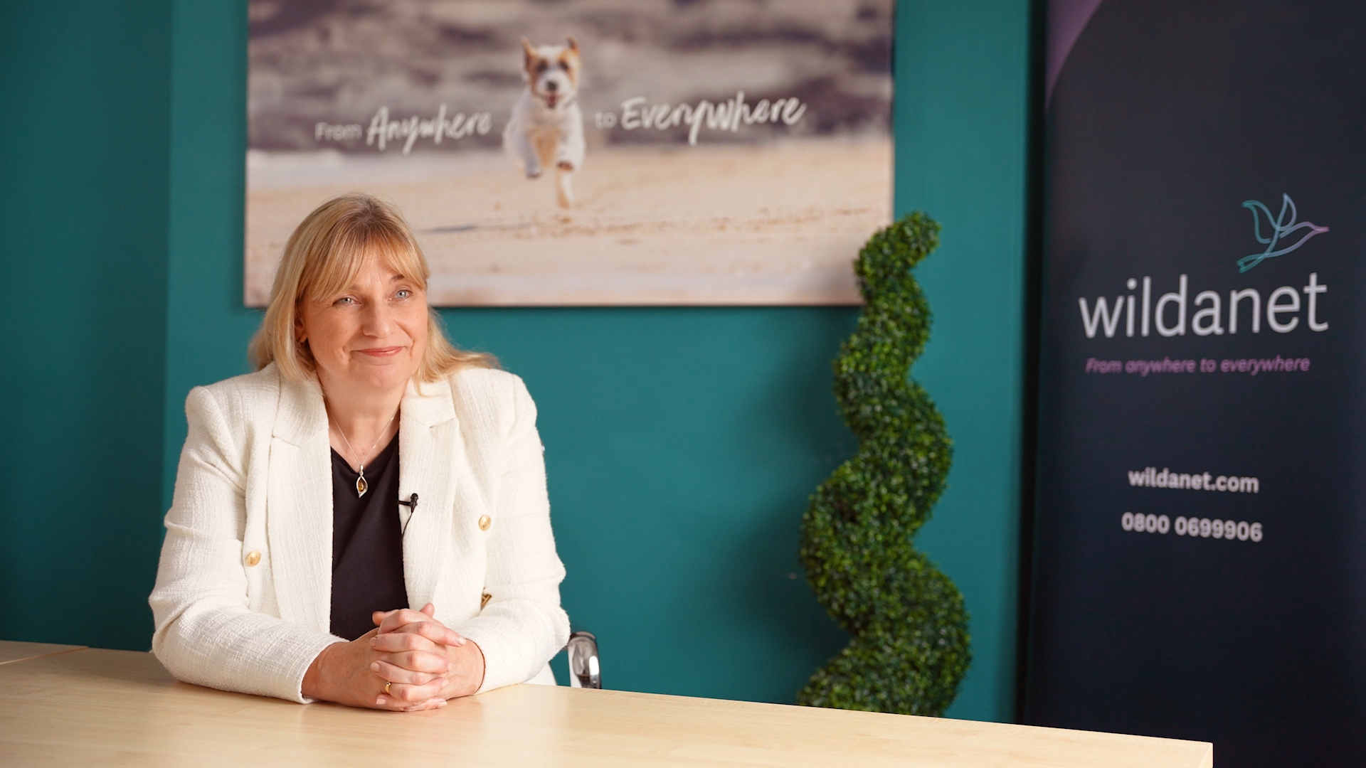 photo of helen wylde sat at a desk