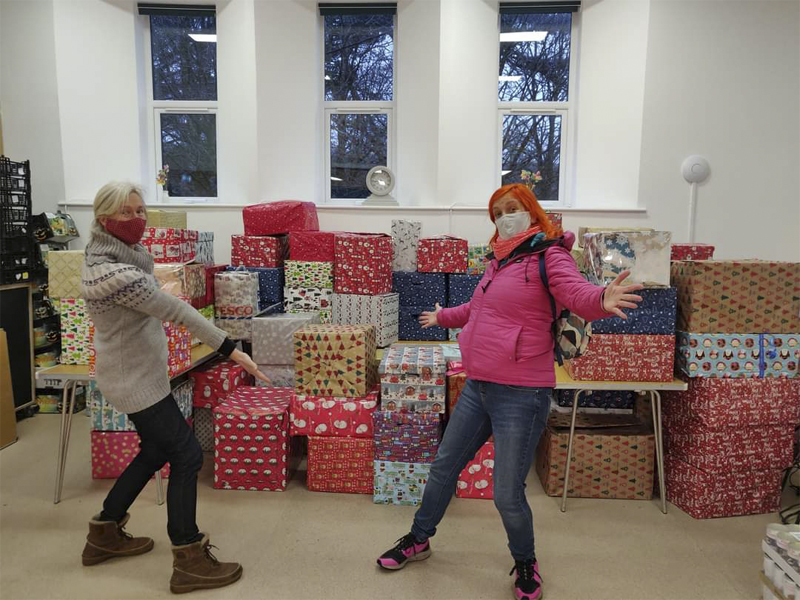 2 People in Room Full of Christmas Presents